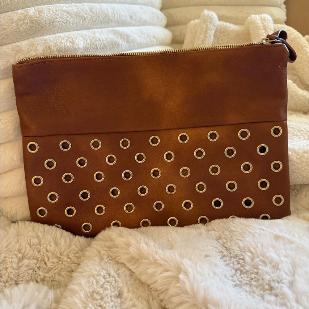 CHICO’S Brown Leather Clutch with Eyelet Design
Leopard lining